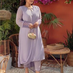 Elegant Lavender Outfit with Gold Clutch